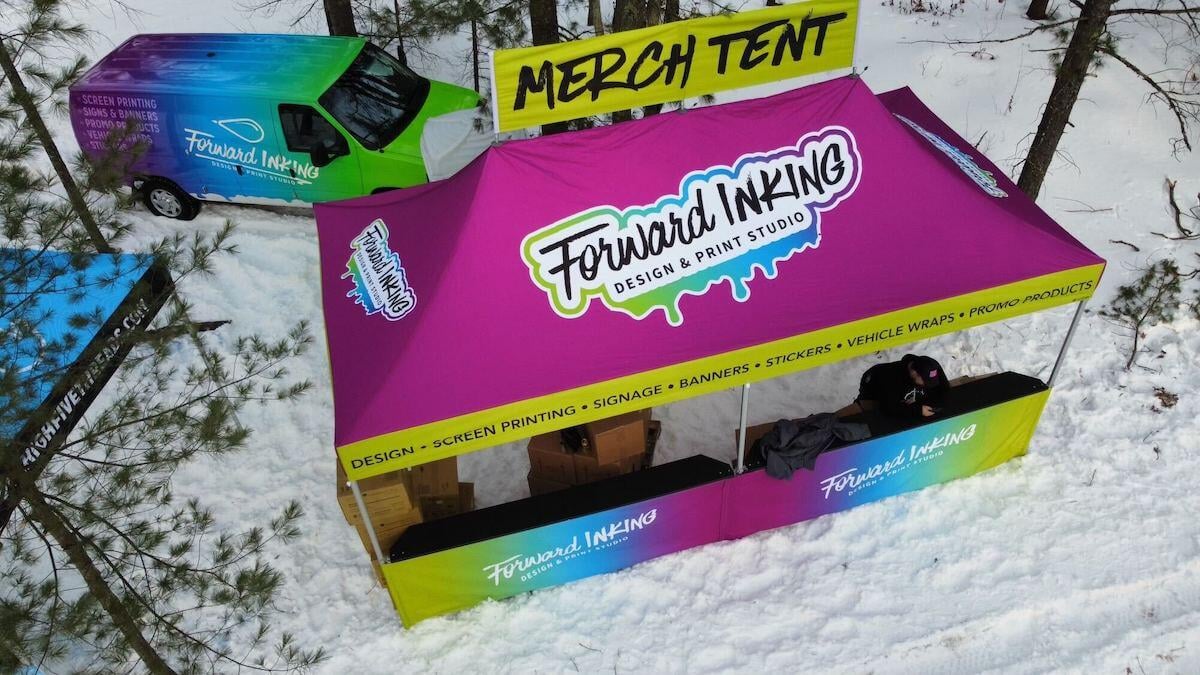 A custom 10x20 pop-up tent at an outdoor winter event