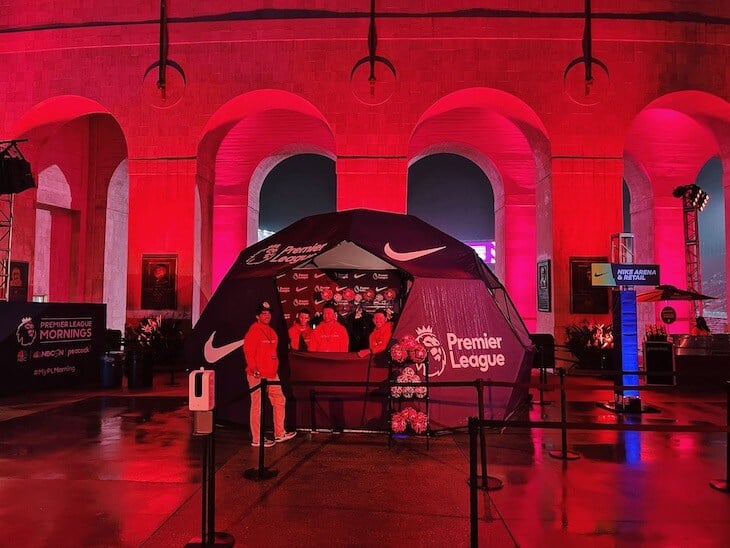 A TentCraft Event Dome branded for the Premier League Fan Fest shown at night