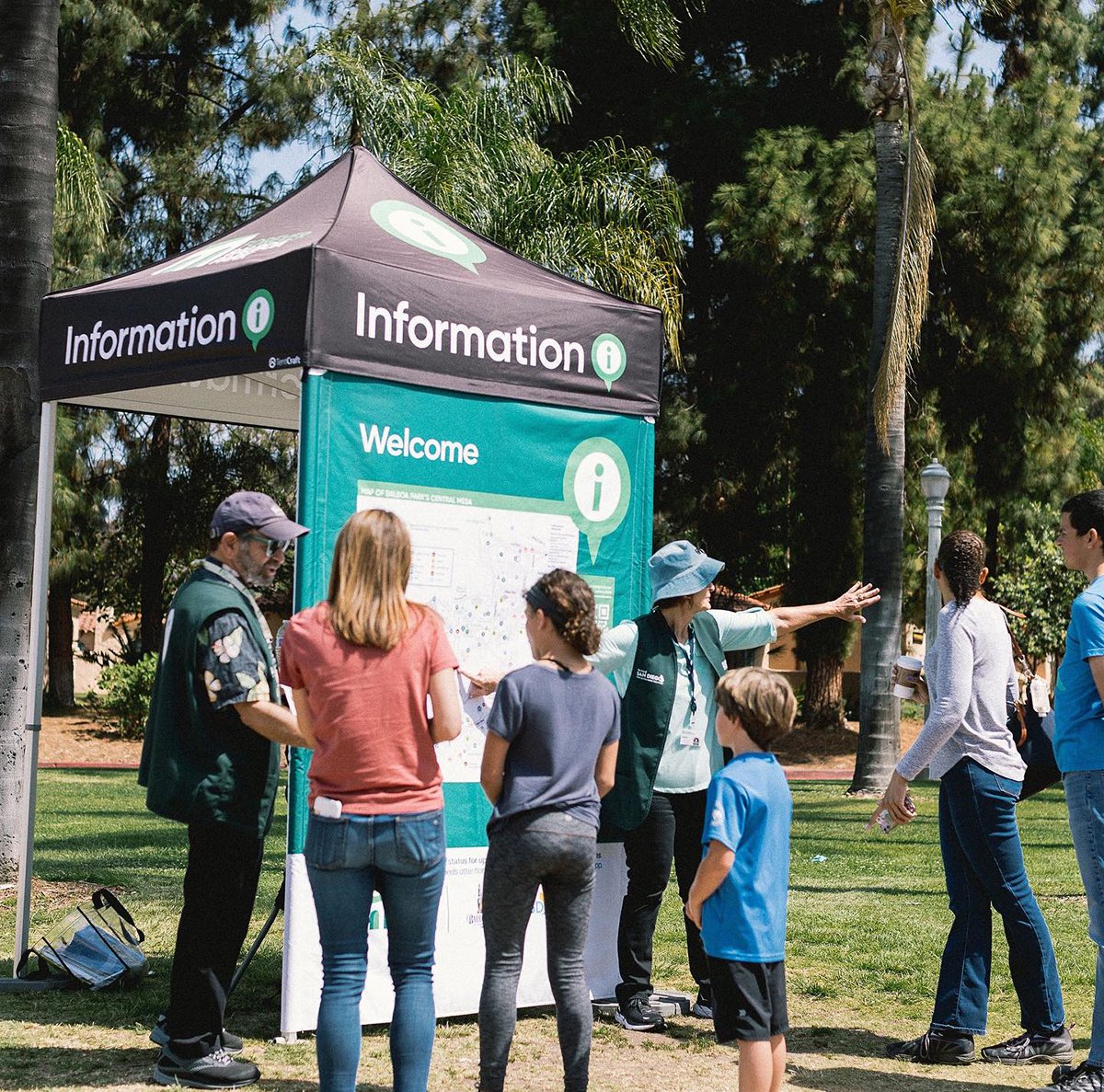 A custom 5x5 heavy-duty tent with custom printed wall featuring park map 