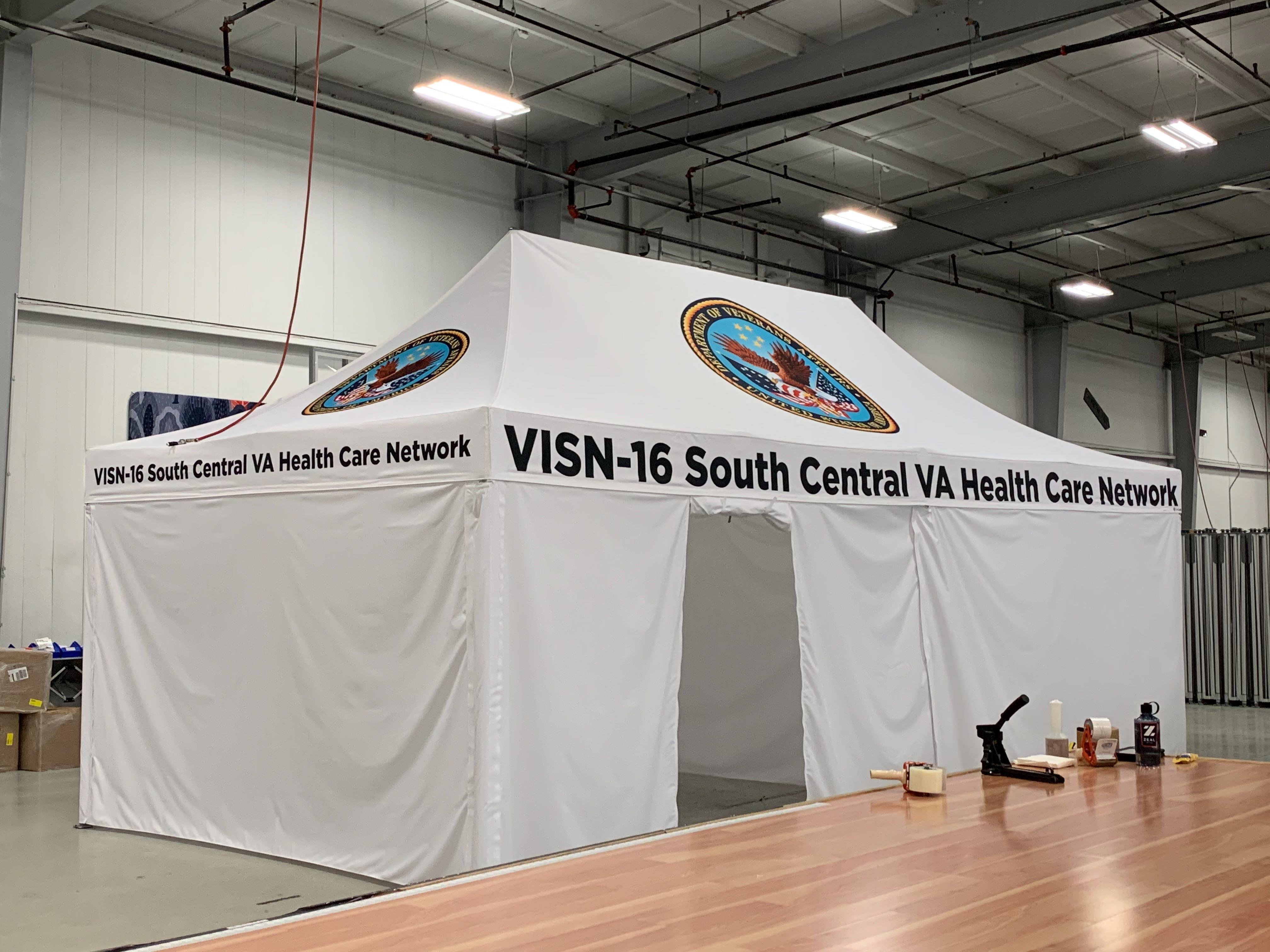 White 10x20 popup medical tent with rollup entryway and custom printing for the south central VA healthcare network