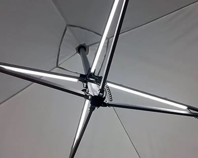 Example of overhead LED lighting kit attached to pop up tent frame