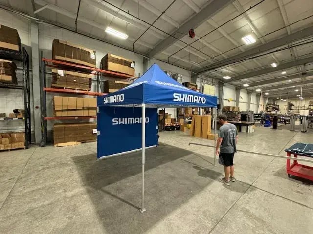 How long does it take to build and deliver a custom pop-up tent?