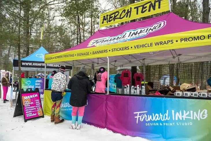 A custom retail tent at an outdoor event in the winter.