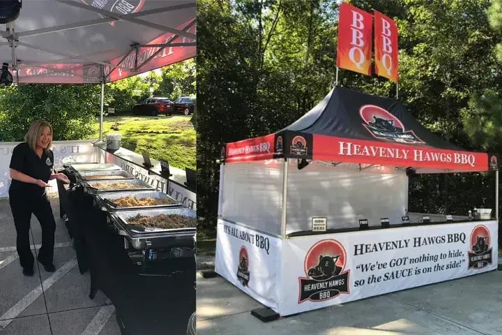 A 10x15 heavy-duty pop-up tent with full, half walls, countertops, and double flags used for food service by Heavenly Hawgs BBQ, an Atlanta catering company.