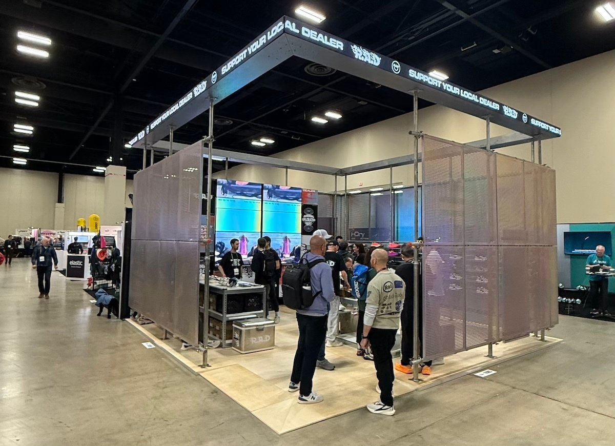 Restrained on Outside of Booth Activation Teases Inside