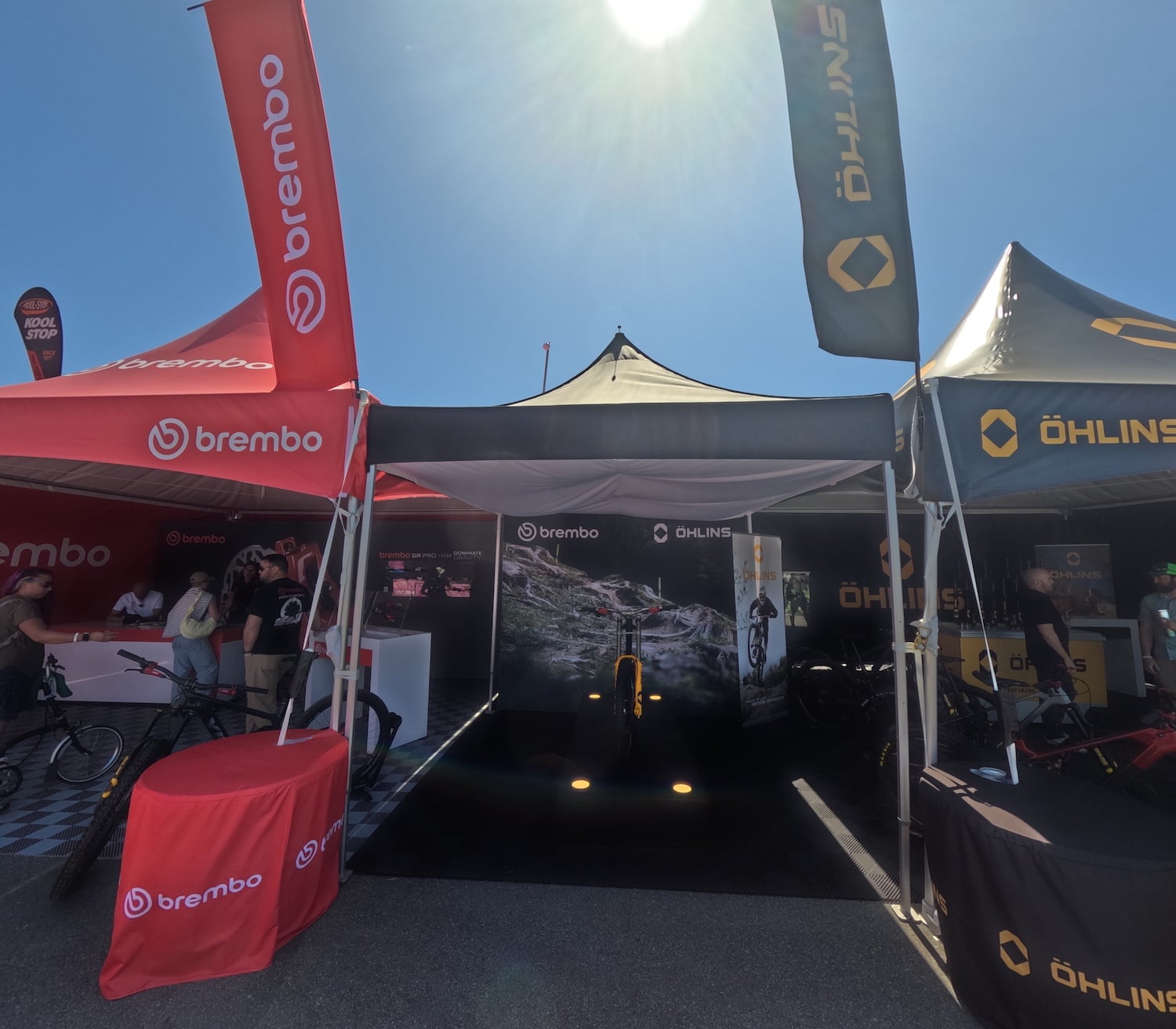 Brembo and Ohlins Frame Tents Connected by 10x20 Pop Up Tents