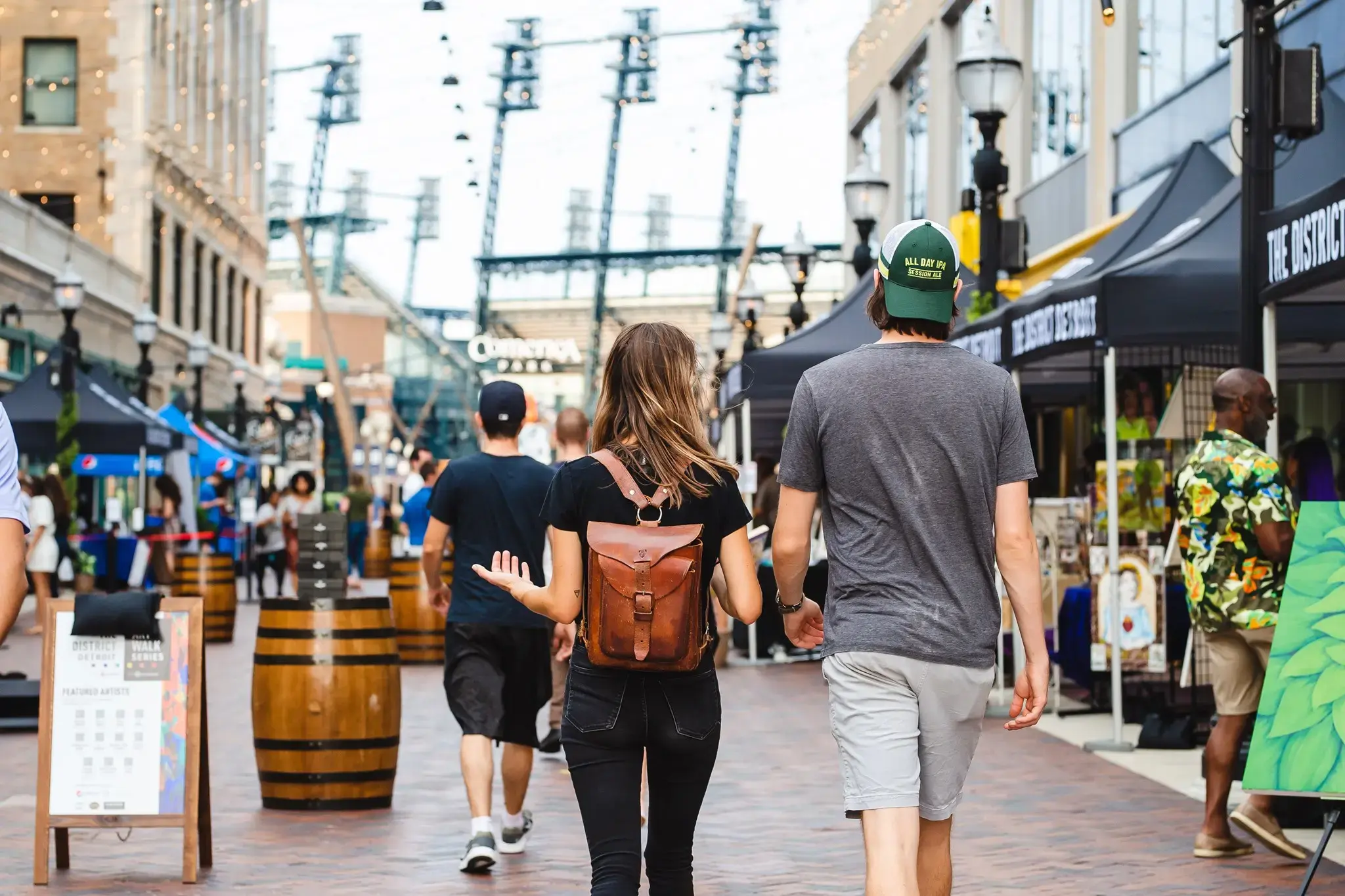 Shoppers walk through a market inside the District Detroit
