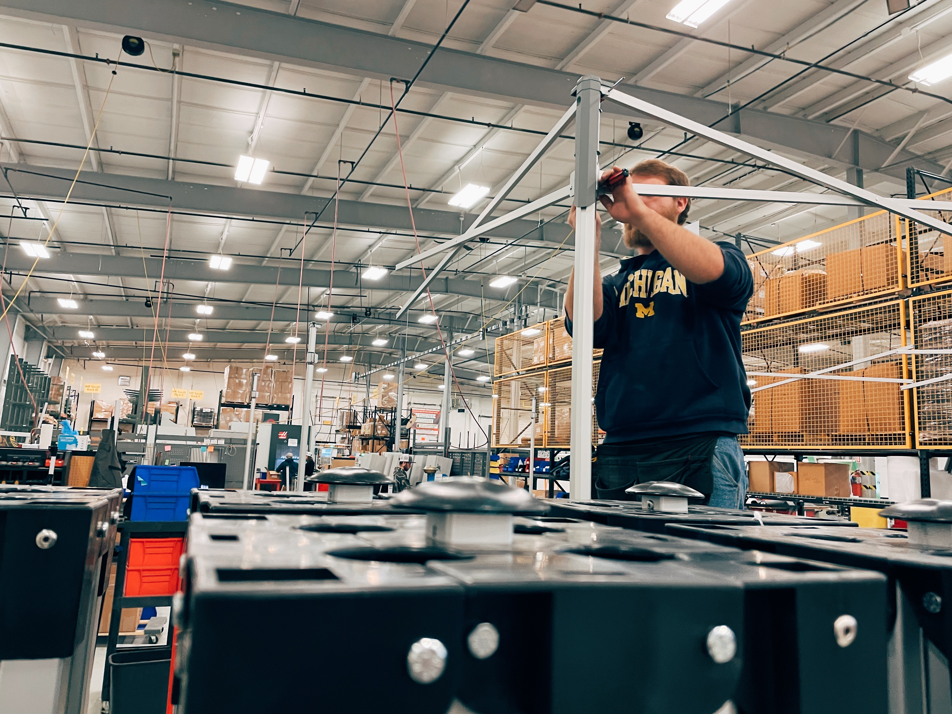 TentCraft employee assembles a pop-up tent on the production floor