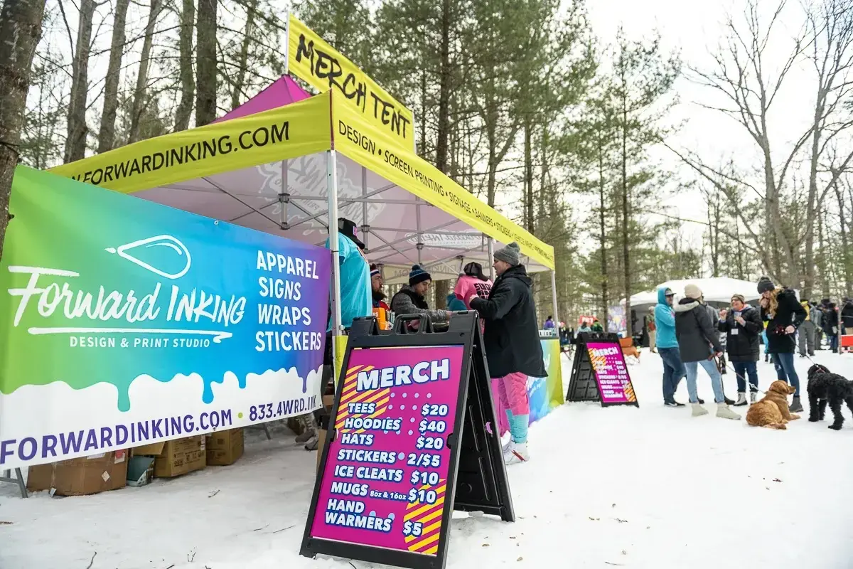 A custom A-frame banner at an outdoor event in the winter