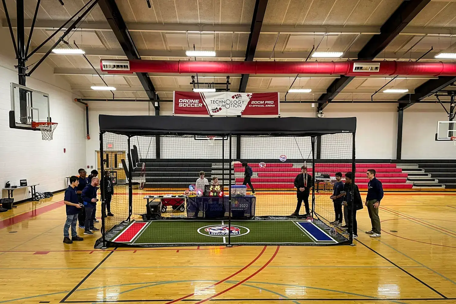 Pop-up drone enclosure used for a drone soccer match