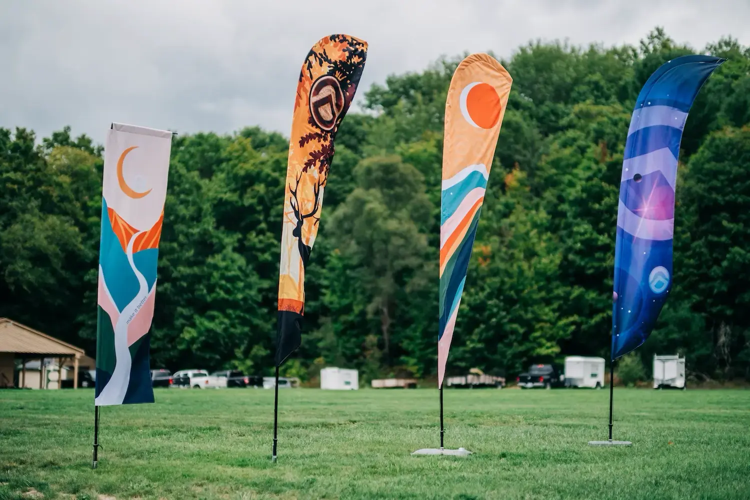 Custom event flags in rectangular, shark fin, teardrop, and feather style