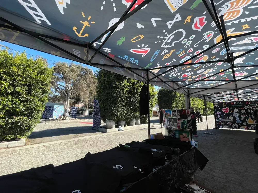 Under a custom pop-up tent for Greater Than Distribution