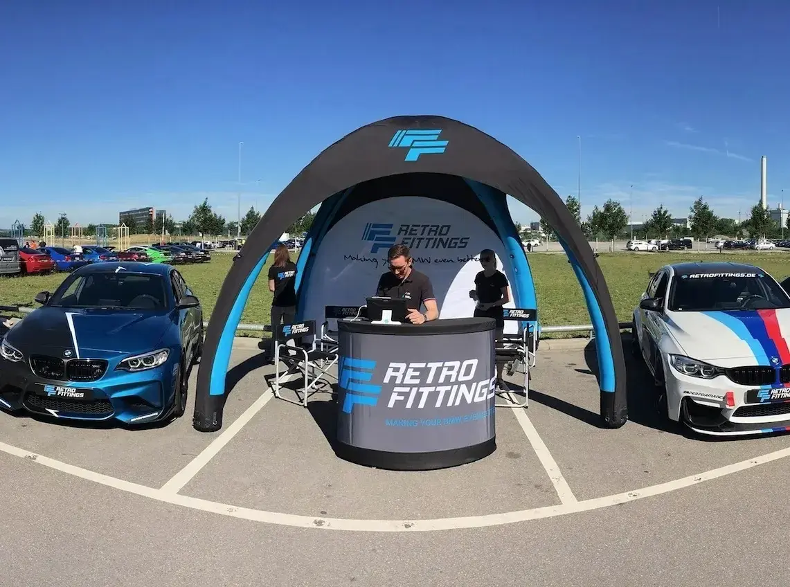 An inflatable podium under an inflatable tent for an outdoor event