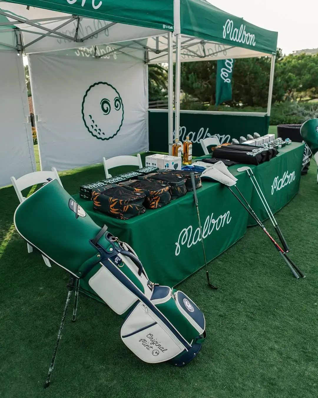 A retail setup under Malbon Golf tents