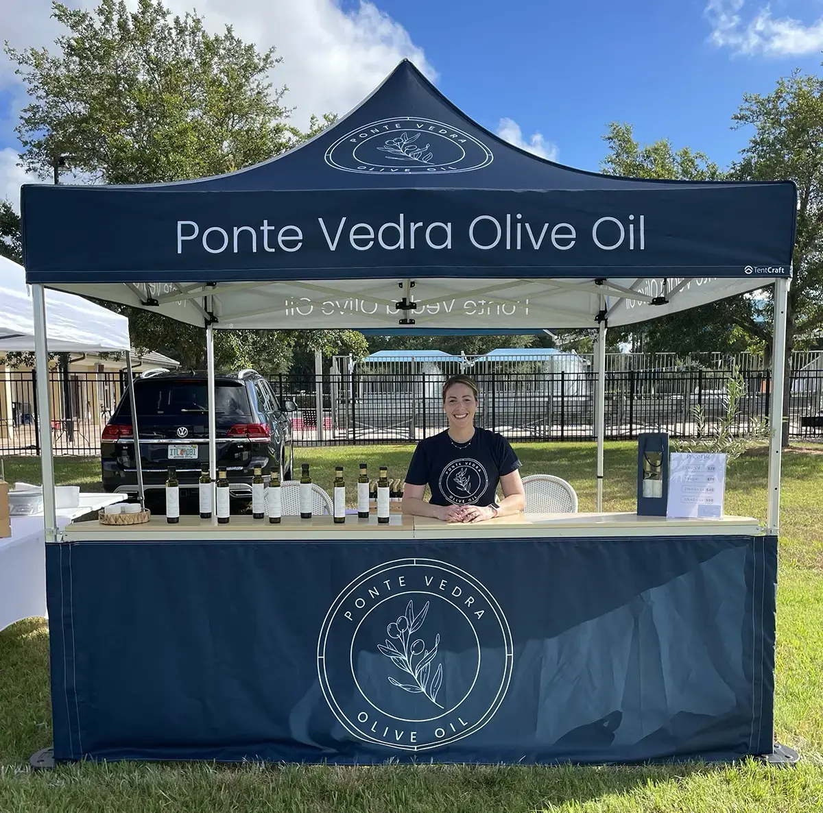 Custom counters on a pop-up tent for a farmers market vendor